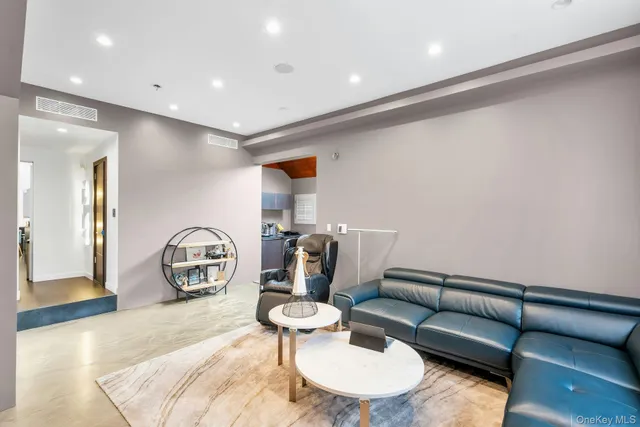 a kitchen with stainless steel appliances granite countertop a sink a stove and a refrigerator