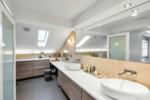 a bedroom with bed and a couch