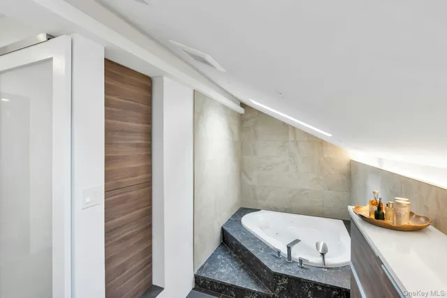 a bathroom with a shower and a sink