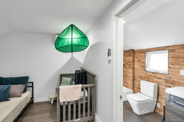 a bed room with furniture and a window