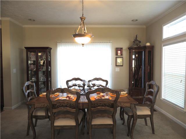 2244 Clara Mathis Road Spring Hill, TN 37174 - Photo 3 of 19 Dining room is open to living room and kitchen idea for large gatherings. Sliding glass doors open to large back deck.