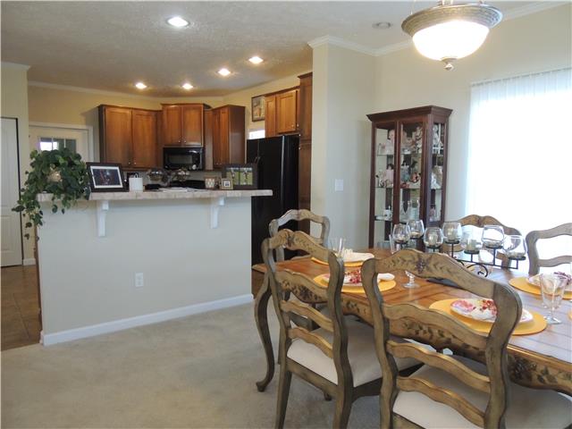 2244 Clara Mathis Road Spring Hill, TN 37174 - Photo 5 of 19 High top counter between dining room and kitchen will accommodate up to 4 bar stools for extra seating.