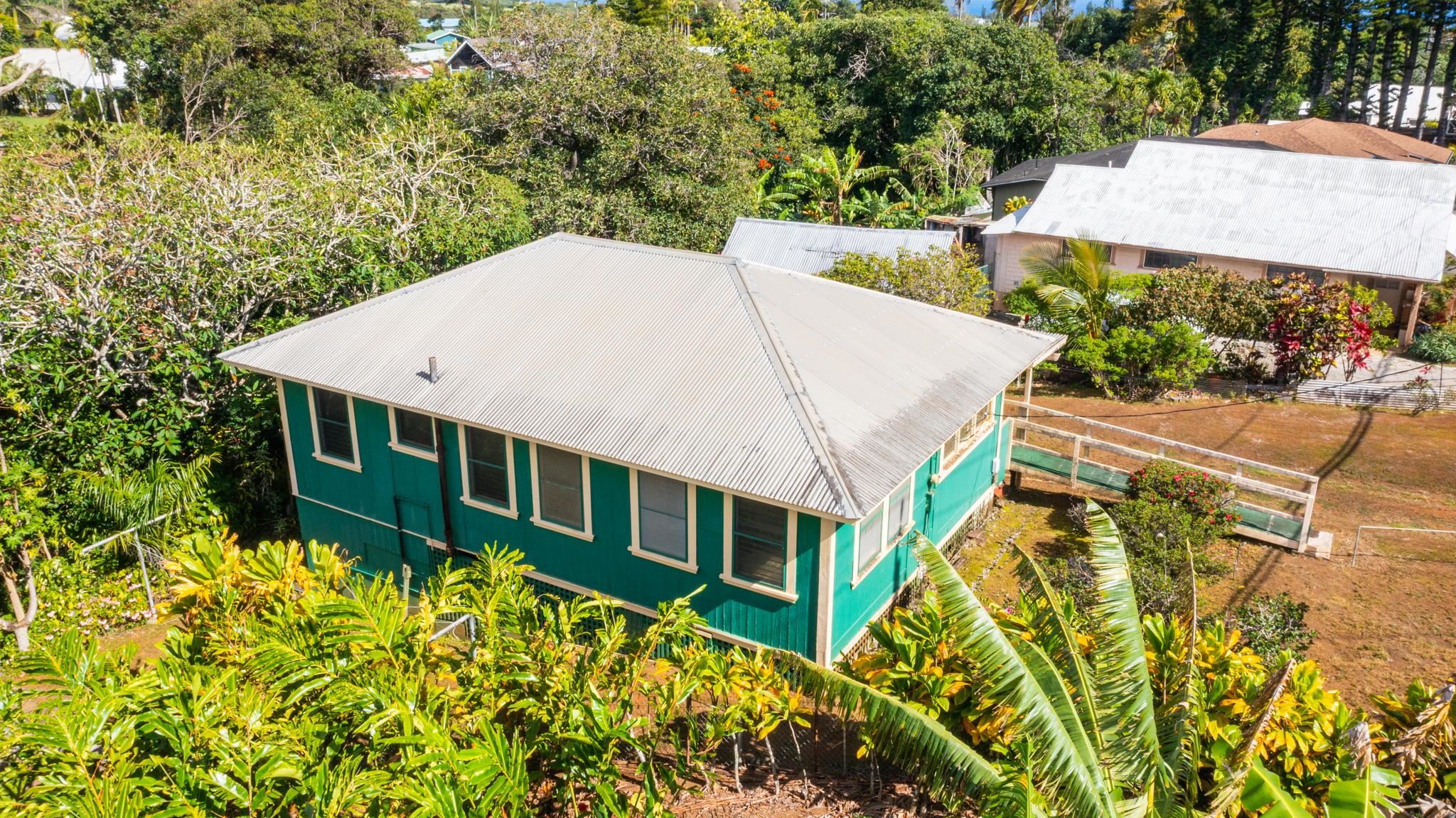 438 West Kuiaha Road Haiku, HI 96708 - Photo 3 of 10 an aerial view of a house with swimming pool garden and patio
