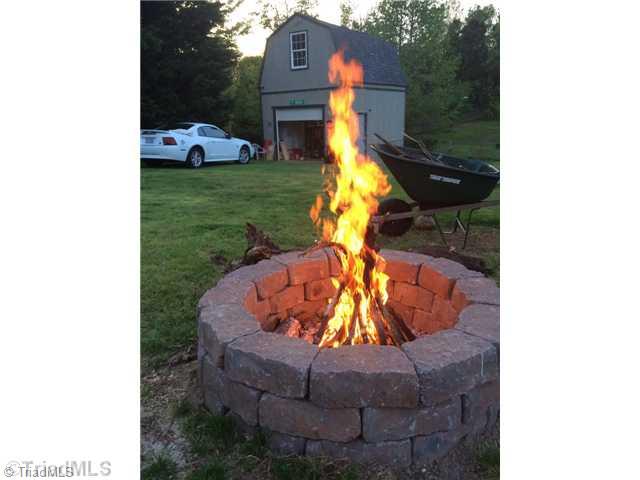 211 Albertson Road Thomasville, NC 27360 - Photo 16 of 18 Enjoy the fire pit on a brisk Spring evening.
