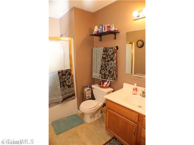 211 Albertson Road Thomasville, NC 27360 - Photo 8 of 18 Master Bath with tile floor.