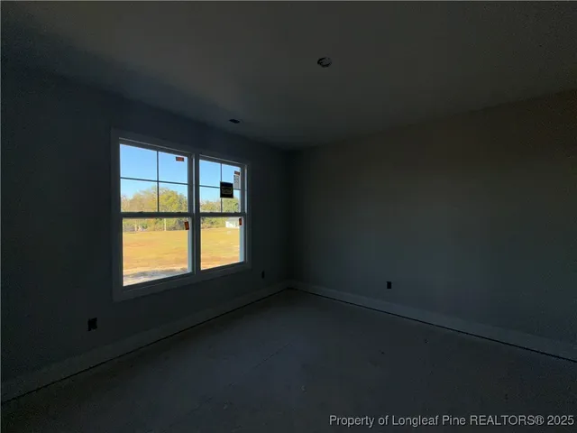 a bathroom with a granite countertop sink a toilet and a mirror