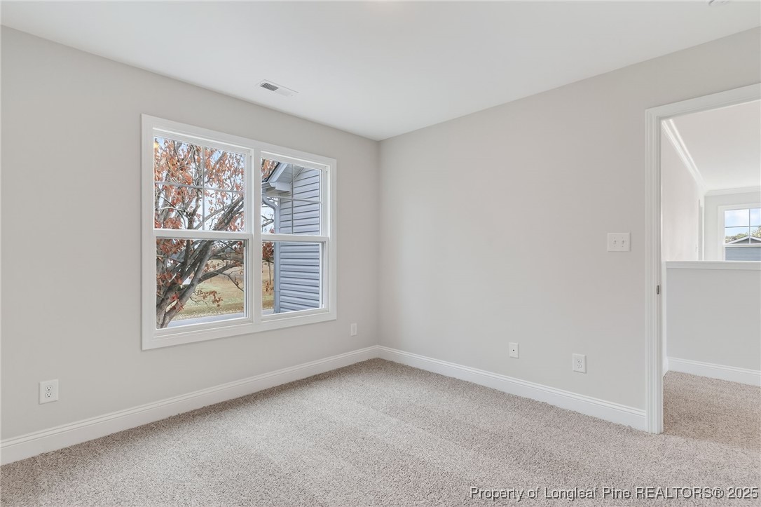 419 Delmore Road Autryville, NC 28318 - Photo 16 of 34 an empty room with a window