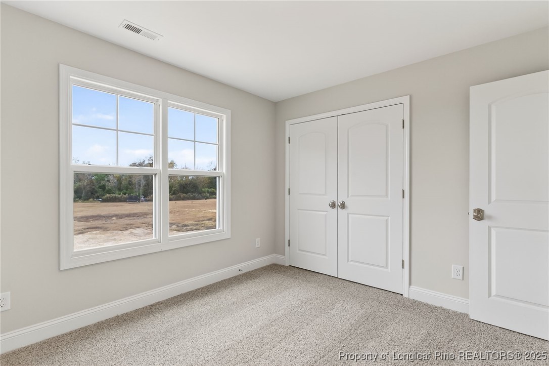 419 Delmore Road Autryville, NC 28318 - Photo 28 of 34 a view of an empty room with a window