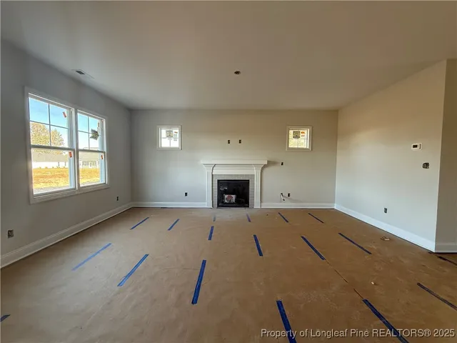 an empty room with fireplace