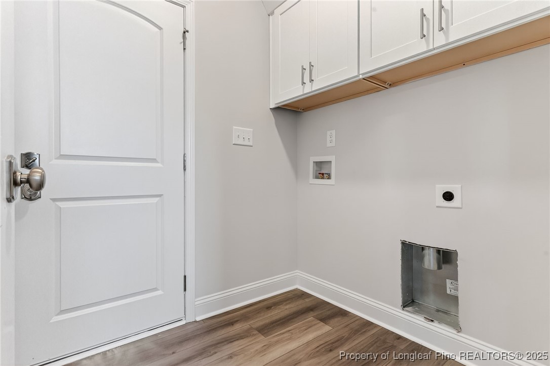 419 Delmore Road Autryville, NC 28318 - Photo 31 of 34 a view of a closet area with hardwood floor