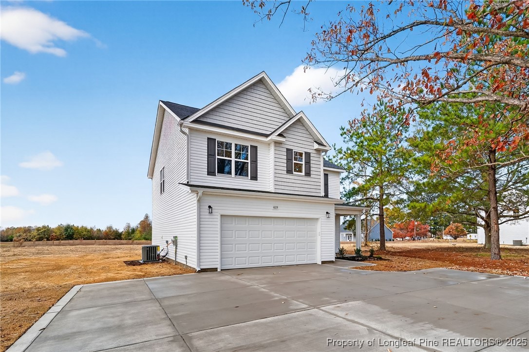 419 Delmore Road Autryville, NC 28318 - Photo 4 of 34 a view of a house with a patio