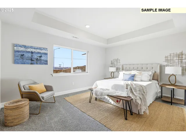 a bed room with a bed and a chair