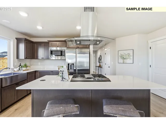 a kitchen with a sink cabinets and window