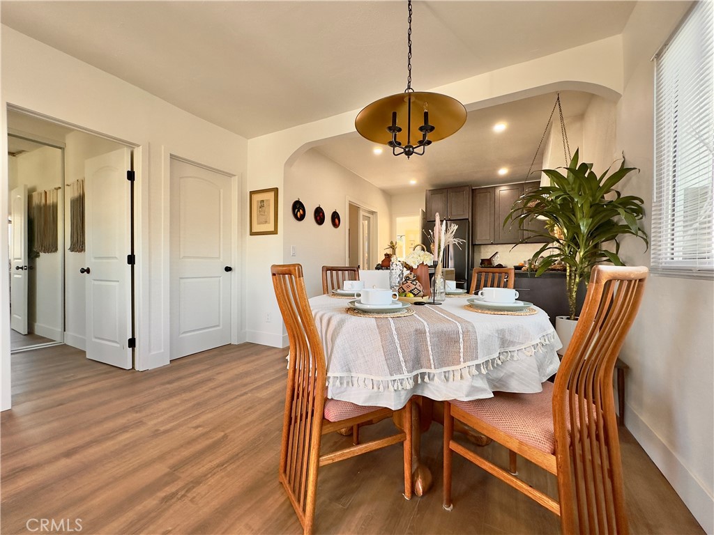 2907 South Ridgeley Drive Los Angeles, CA 90016 - Photo 11 of 37 a view of a dining room with furniture and chandelier