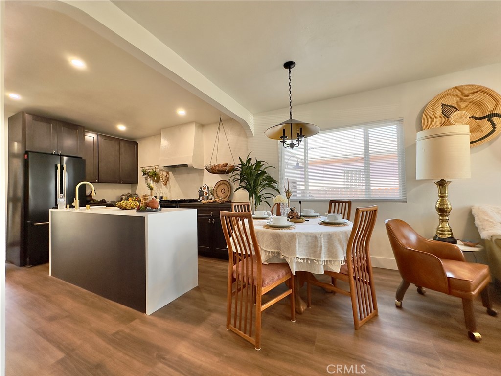 2907 South Ridgeley Drive Los Angeles, CA 90016 - Photo 13 of 37 a view of a dining room with furniture window and wooden floor
