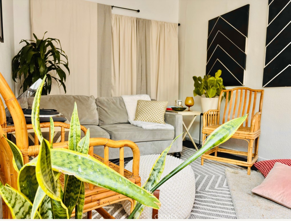 2907 South Ridgeley Drive Los Angeles, CA 90016 - Photo 32 of 37 a living room with furniture and a floor to ceiling window