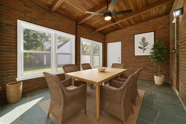 a view of a dining room with furniture window and outside view
