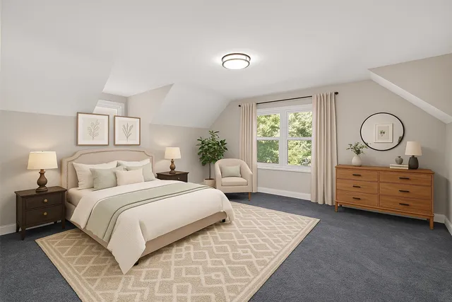 a bedroom with a bed and a dresser