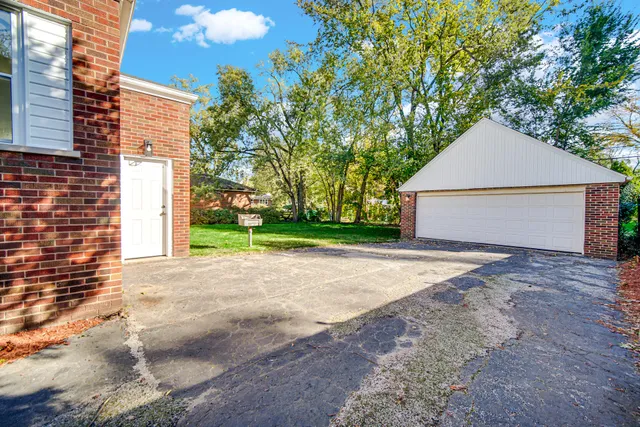 a view of backyard and garage