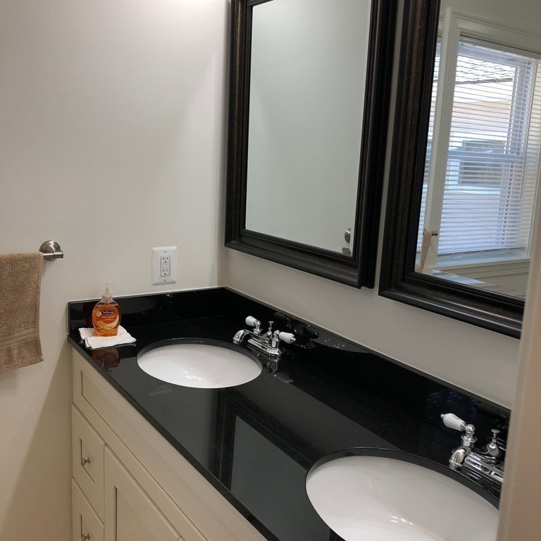 101 Parker Road Lancaster, MA 01523 - Photo 21 of 35 a bathroom with a sink and a mirror