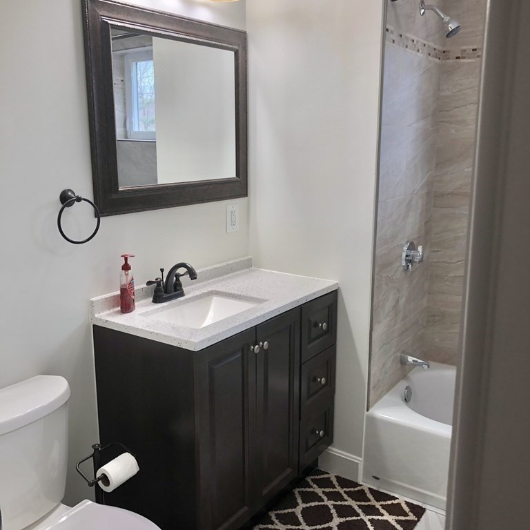 101 Parker Road Lancaster, MA 01523 - Photo 23 of 35 a bathroom with a sink toilet and shower