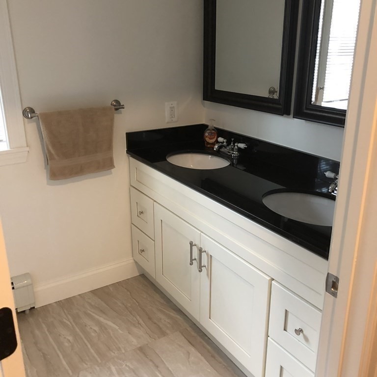 101 Parker Road Lancaster, MA 01523 - Photo 26 of 35 a kitchen with a sink and cabinets