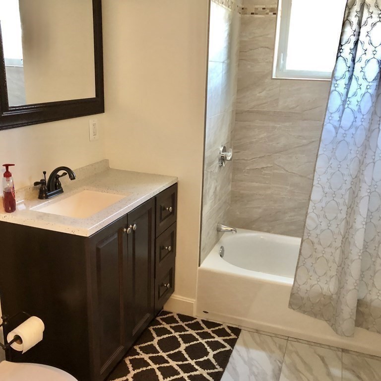 101 Parker Road Lancaster, MA 01523 - Photo 27 of 35 a bathroom with a sink and a mirror
