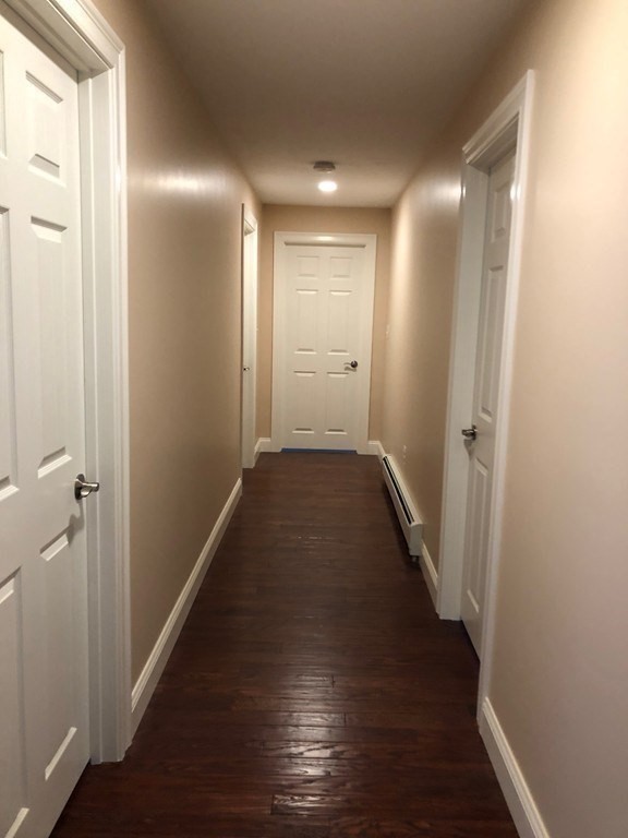 101 Parker Road Lancaster, MA 01523 - Photo 28 of 35 a view of a hallway with wooden floor