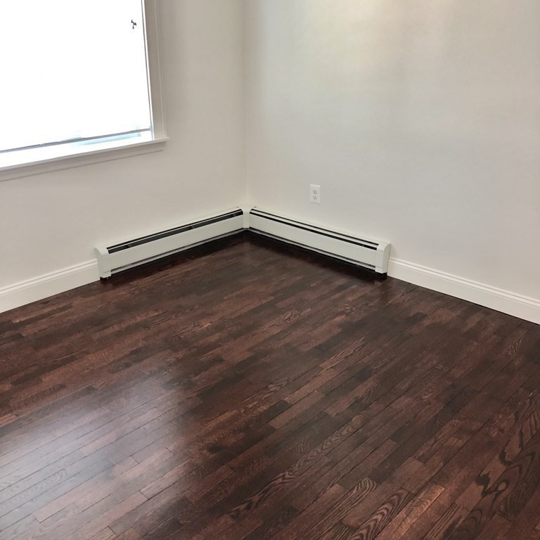 101 Parker Road Lancaster, MA 01523 - Photo 29 of 35 a view of a room with wooden floor and a window