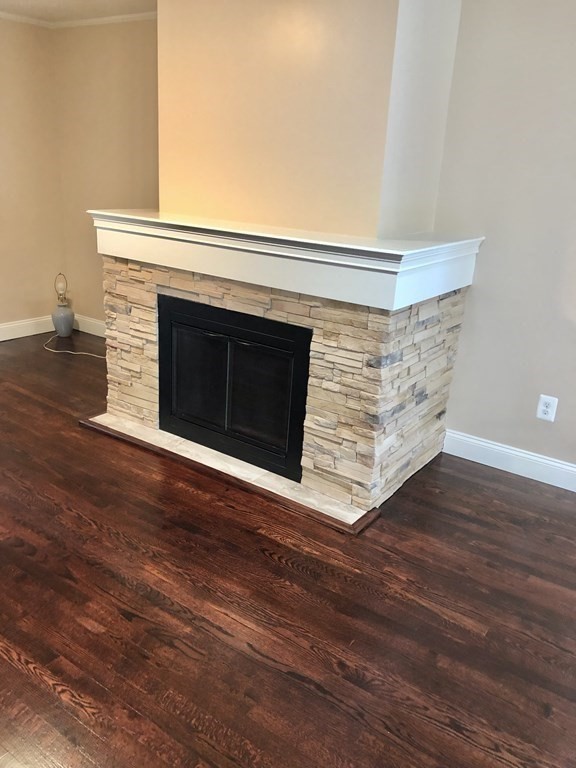101 Parker Road Lancaster, MA 01523 - Photo 32 of 35 a view of an empty room with wooden floor