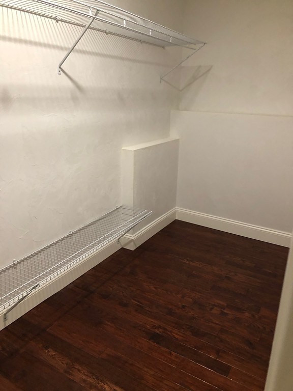 101 Parker Road Lancaster, MA 01523 - Photo 34 of 35 a view of a room with wooden floor and cabinet