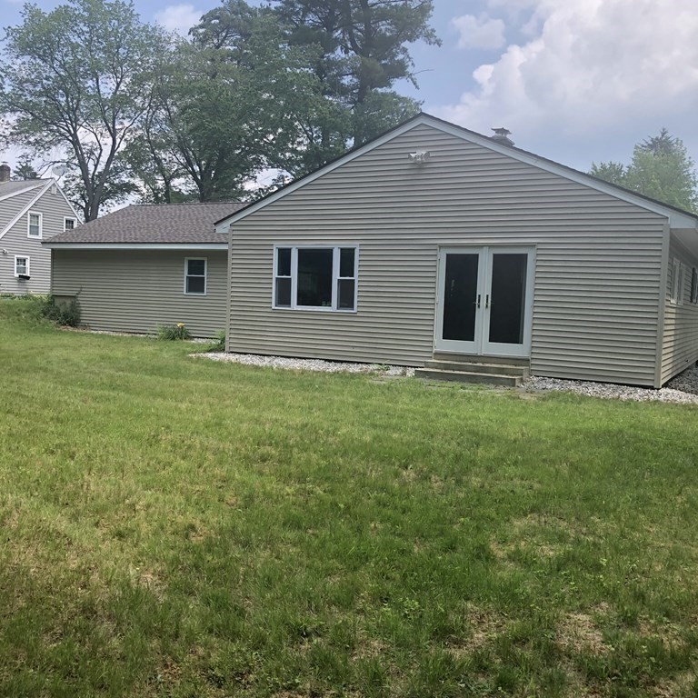 101 Parker Road Lancaster, MA 01523 - Photo 5 of 35 a house that is sitting in the grass