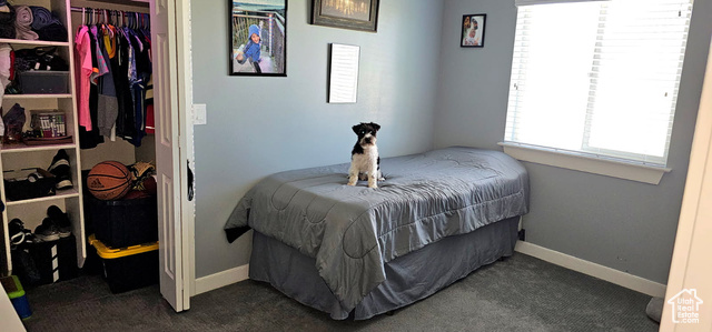 2269 Clear Creek Road Nibley, UT 84321 - Photo 12 of 27 Bedroom with dark carpet and a closet