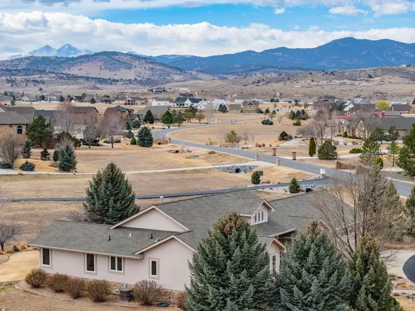an aerial view of residential houses and outdoor space