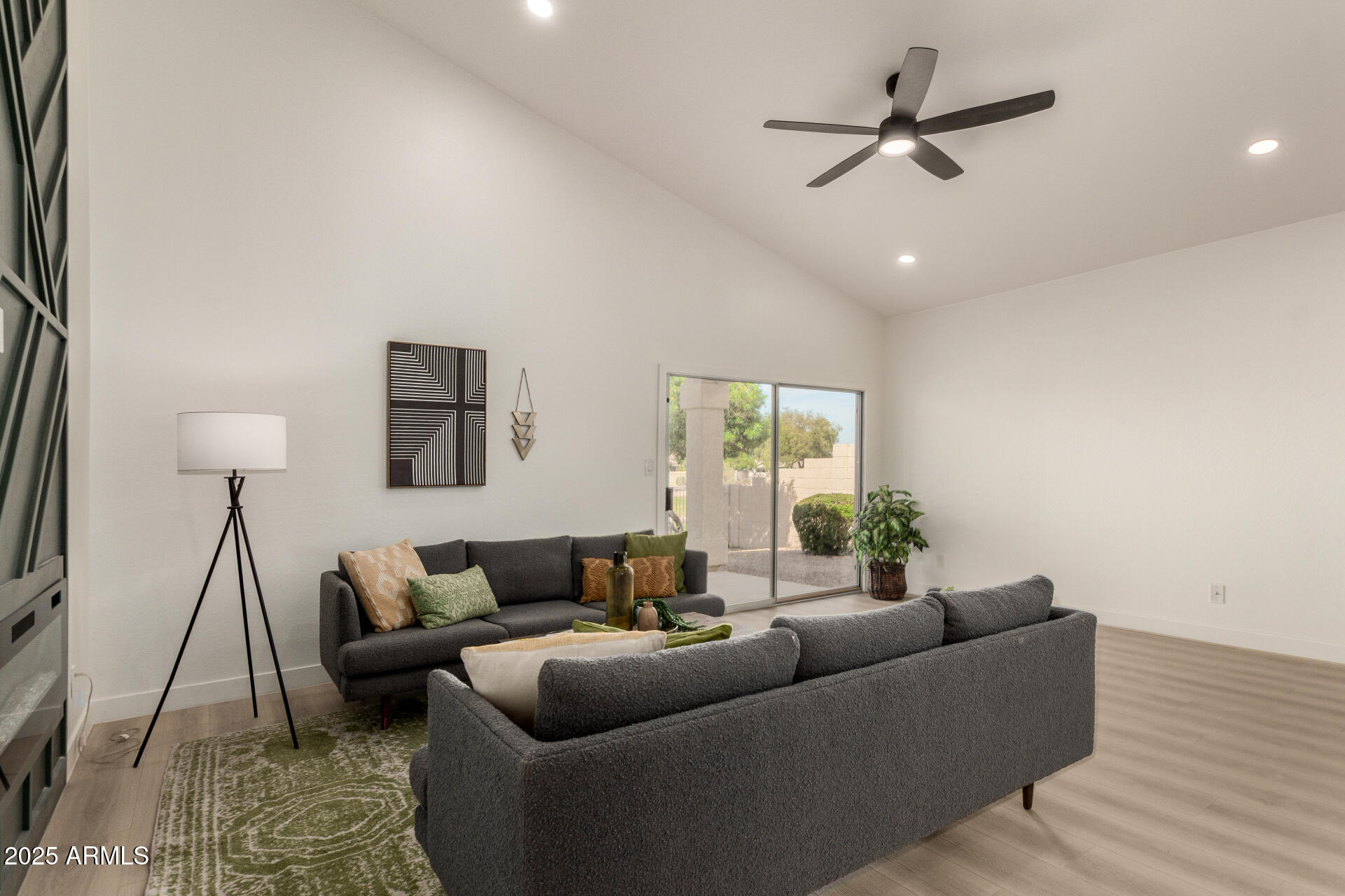 786 South Catalina Street Gilbert, AZ 85233 - Photo 11 of 34 a living room with furniture and a wooden floor