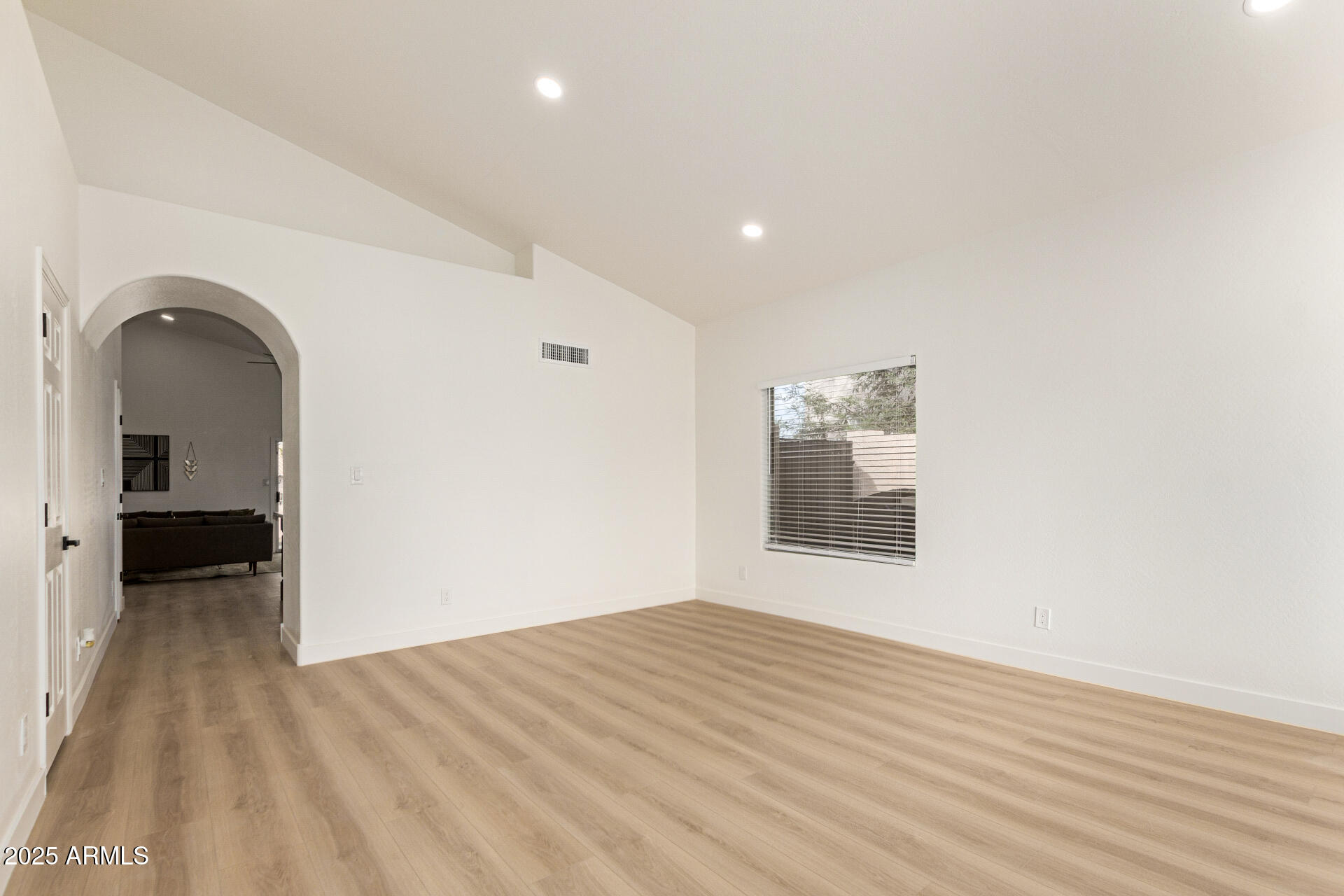 786 South Catalina Street Gilbert, AZ 85233 - Photo 12 of 34 a view of empty room with wooden floor and fan