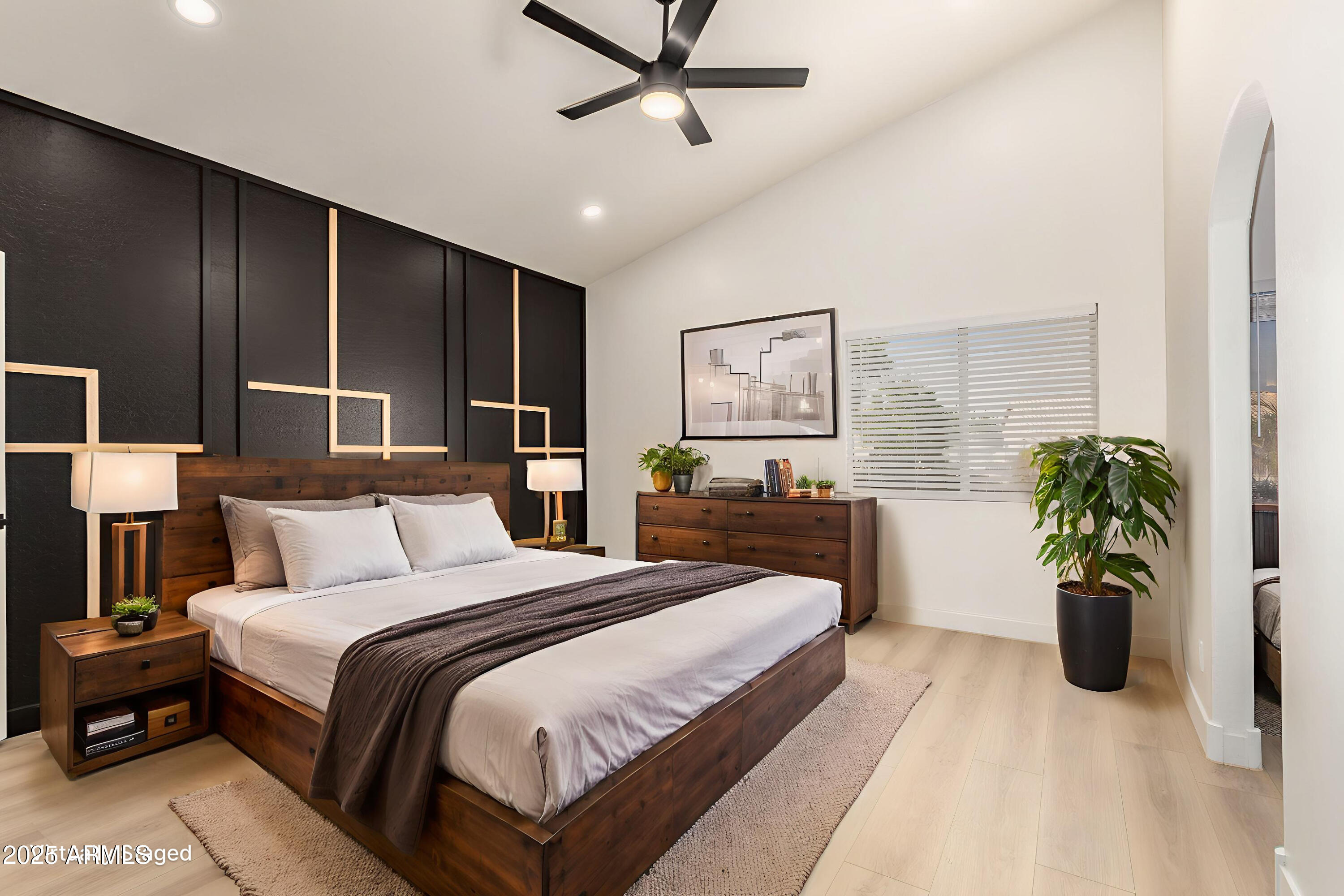 786 South Catalina Street Gilbert, AZ 85233 - Photo 14 of 34 a spacious bedroom with a bed and a potted plant