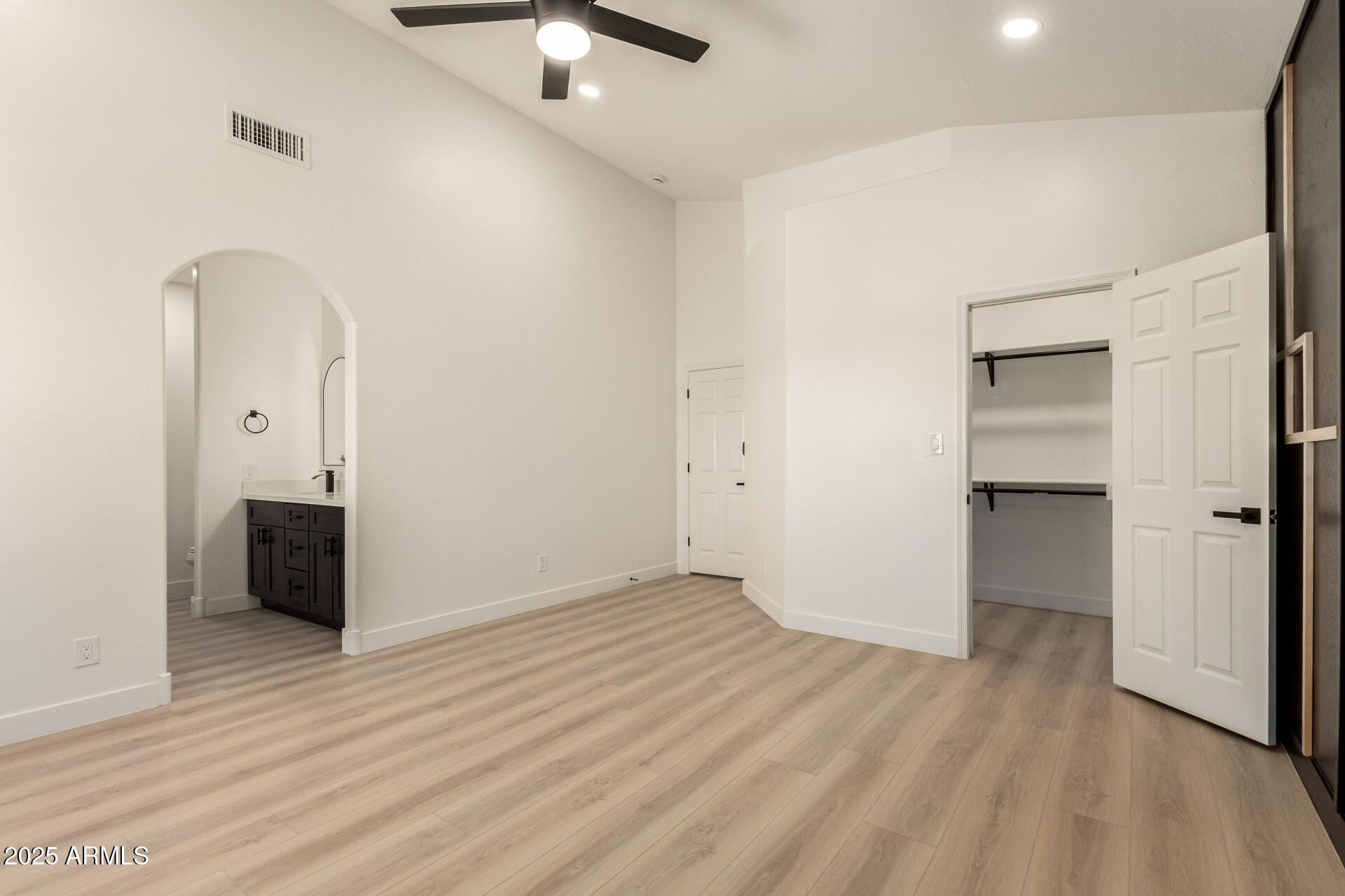 786 South Catalina Street Gilbert, AZ 85233 - Photo 17 of 34 an empty room with wooden floor and windows