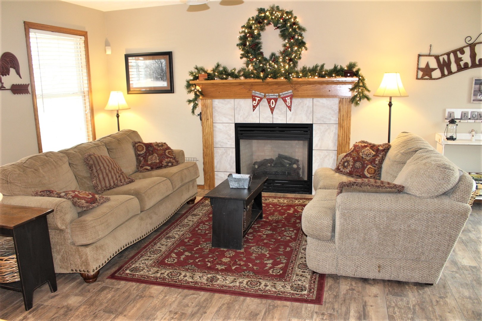4229 Brush College Road Clinton, IL 61727 - Photo 14 of 43 a living room with furniture and a fireplace