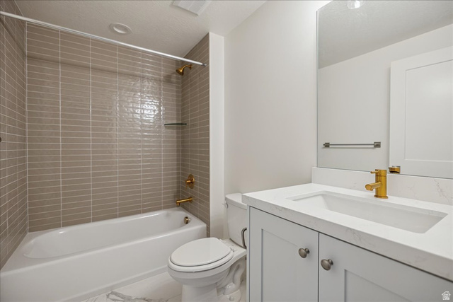 952 Mathilda Drive, Unit 156 Saratoga Springs, UT 84045 - Photo 22 of 25 Ensuite Contemporary bathroom featuring a white vanity with a rectangular undermount sink, a sleek gold-finish faucet, and a large wall-mounted mirror