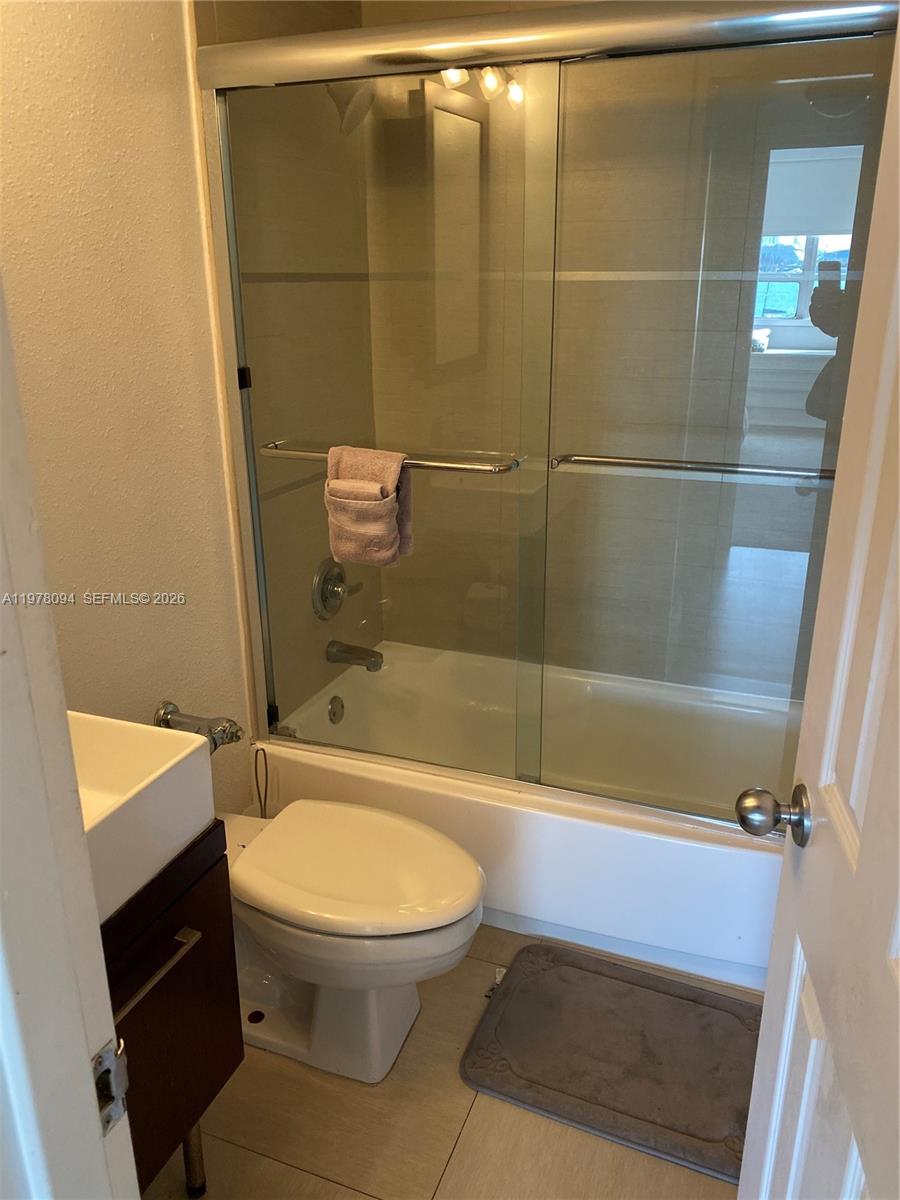 1500 Bay Road, Unit 524S Miami Beach, FL 33139 - Photo 14 of 27 a bathroom with a toilet and a shower