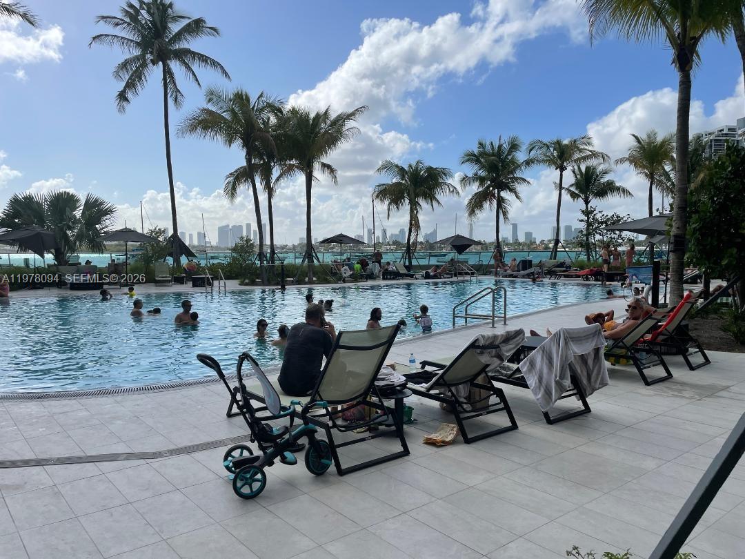 1500 Bay Road, Unit 524S Miami Beach, FL 33139 - Photo 18 of 27 a view of swimming pool with outdoor seating