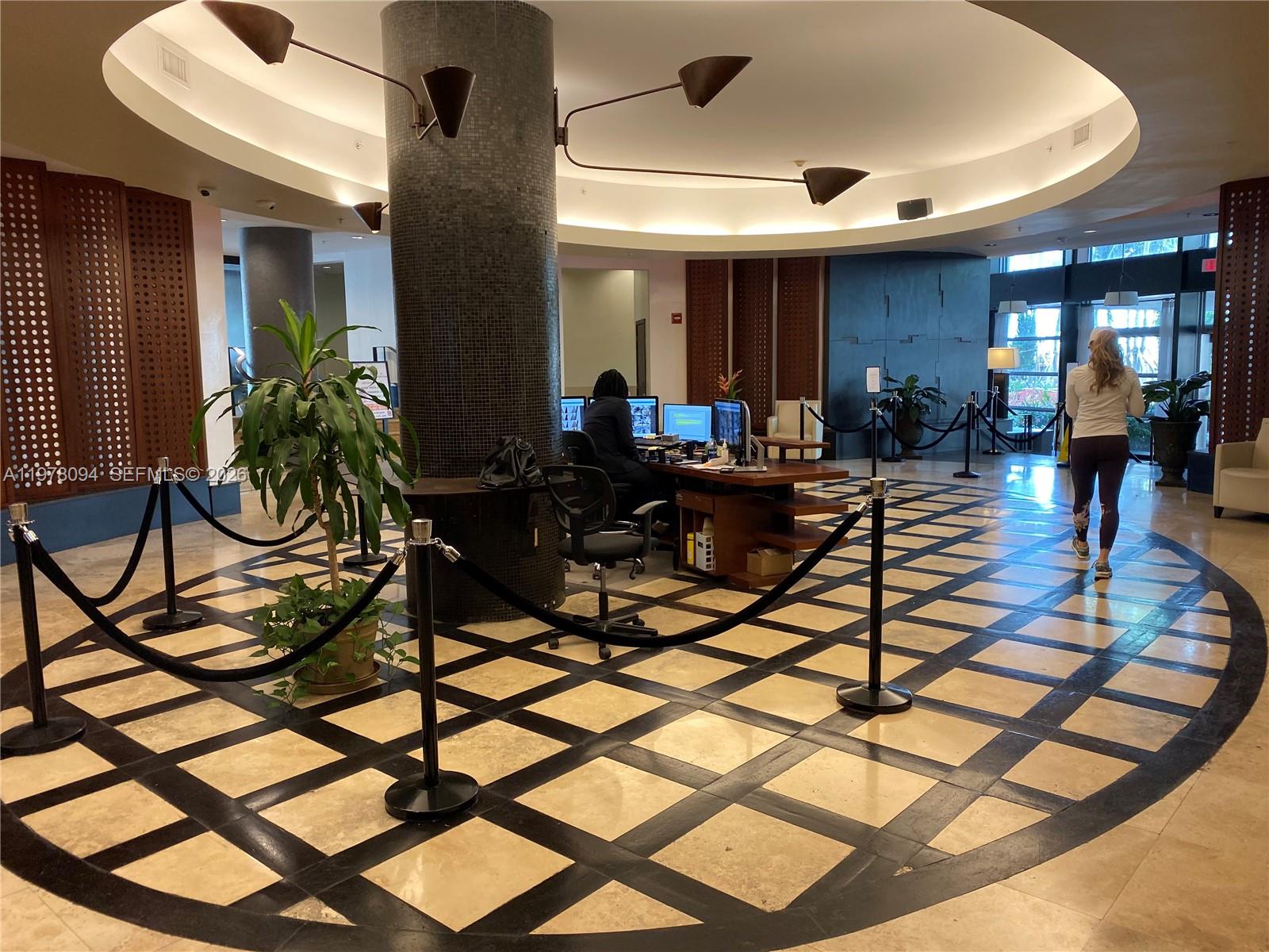 1500 Bay Road, Unit 524S Miami Beach, FL 33139 - Photo 21 of 27 a living room with patio furniture and a dining table