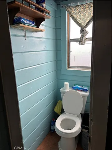 a bathroom with a toilet and a sink
