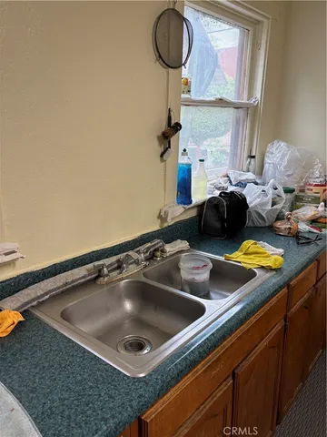 a kitchen with a sink and a stove