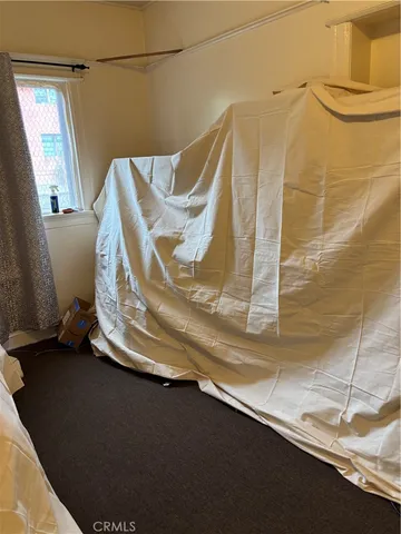 a view of a balcony with wooden floor