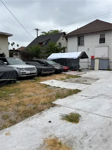 a swimming pool with outdoor seating and yard