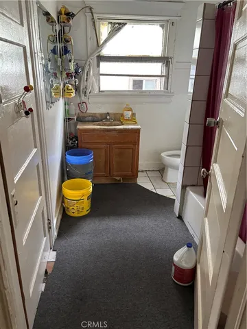 a bathroom with a sink toilet and tub