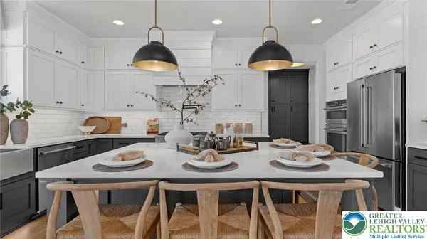 a kitchen with a sink and a white cabinets