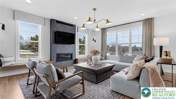 a living room with furniture and a large window